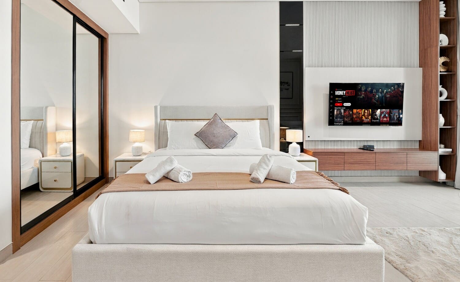 Custom cabinetry with built-in appliances and polished quartz countertops in Business Bay studio