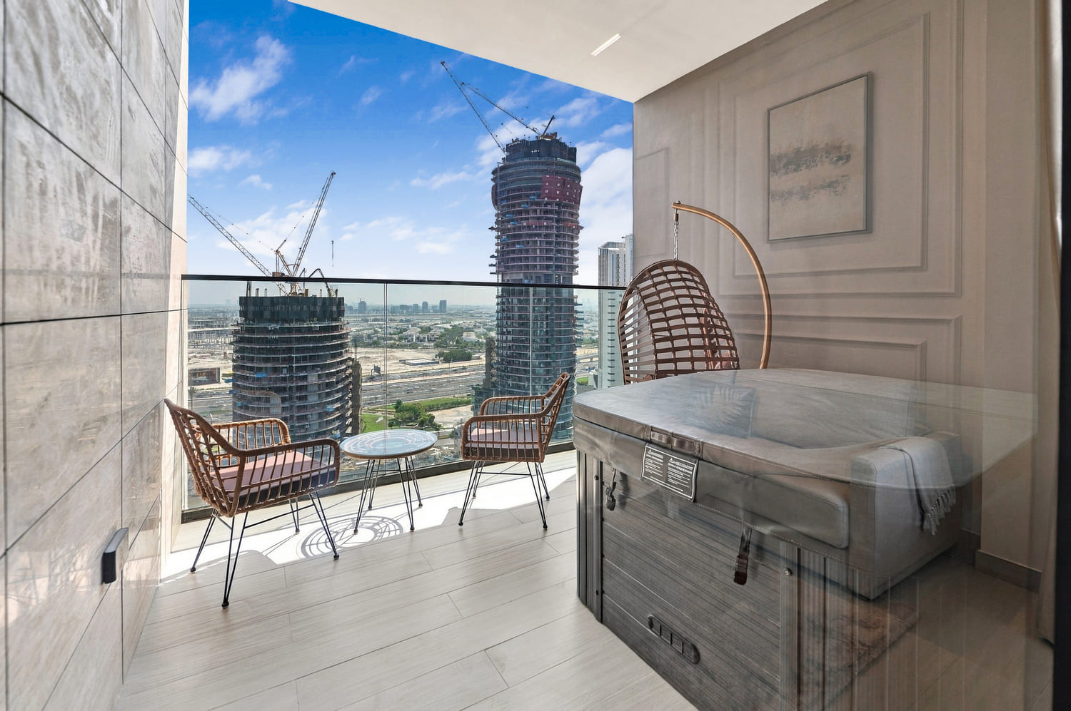 Exterior elevation of Trillionaire Residences rising along the Dubai Canal in Business Bay