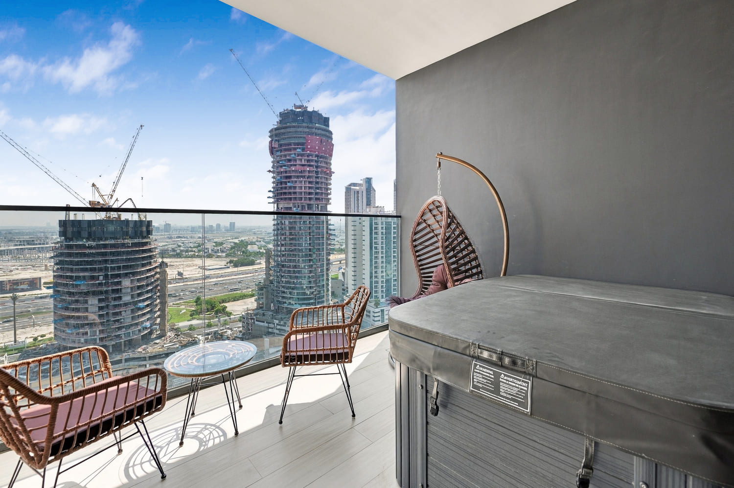 Private outdoor balcony at Trillionaire Residences with sweeping panoramic views of Dubai Canal and Business Bay