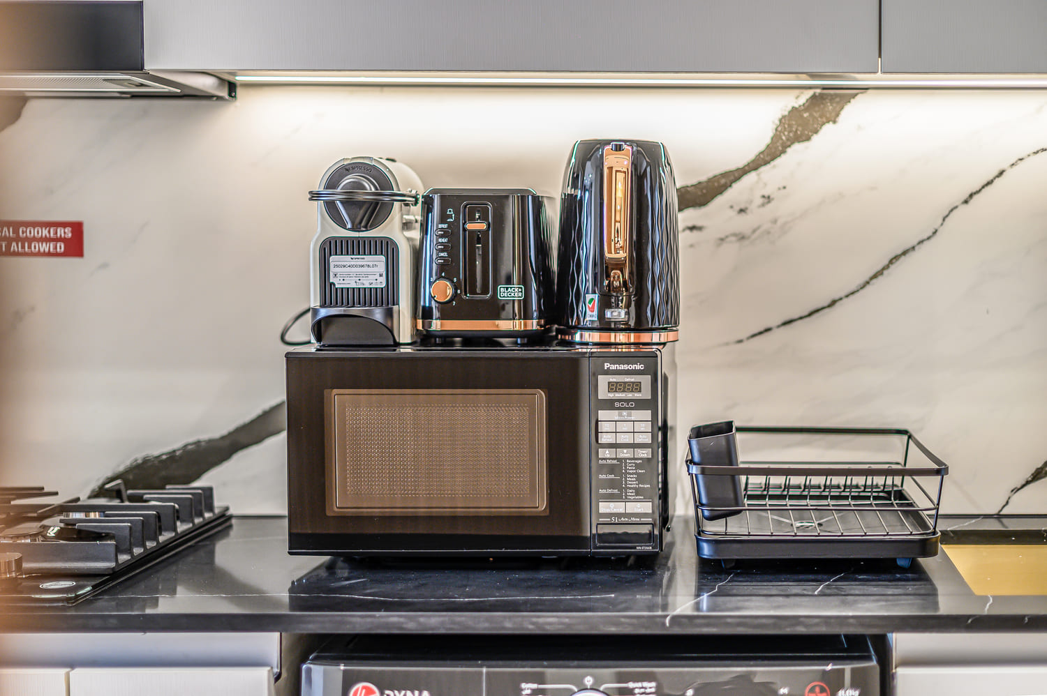 Designer decorative accent pillows and curated textiles creating a high-end boutique hotel vibe