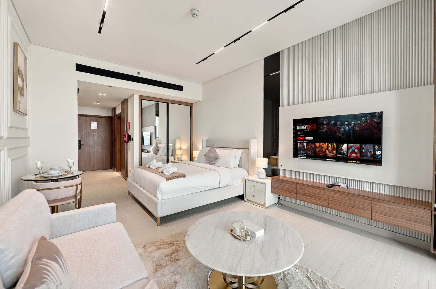 Living room lounge seating and modern accent armchair styled for luxury short-term rental guests in Business Bay
