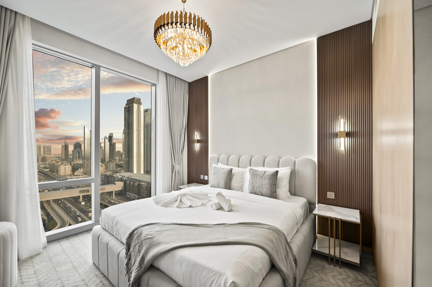 Balcony outdoor seating and glass balustrade framing the Downtown Dubai skyline at Vida Tower 2