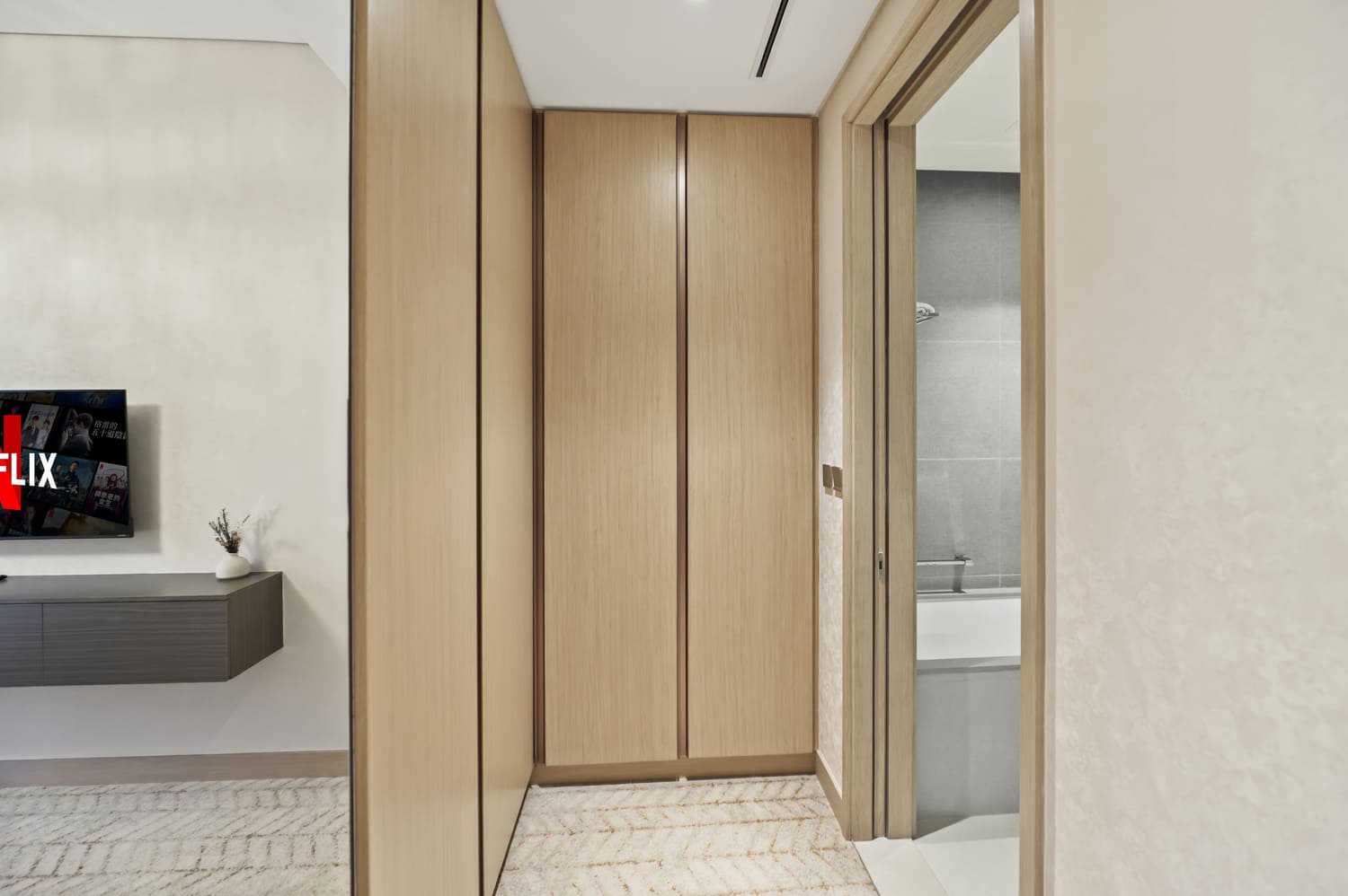Custom built-in wooden bedroom cabinetry and wardrobe storage at Vida Tower 2 Dubai Mall