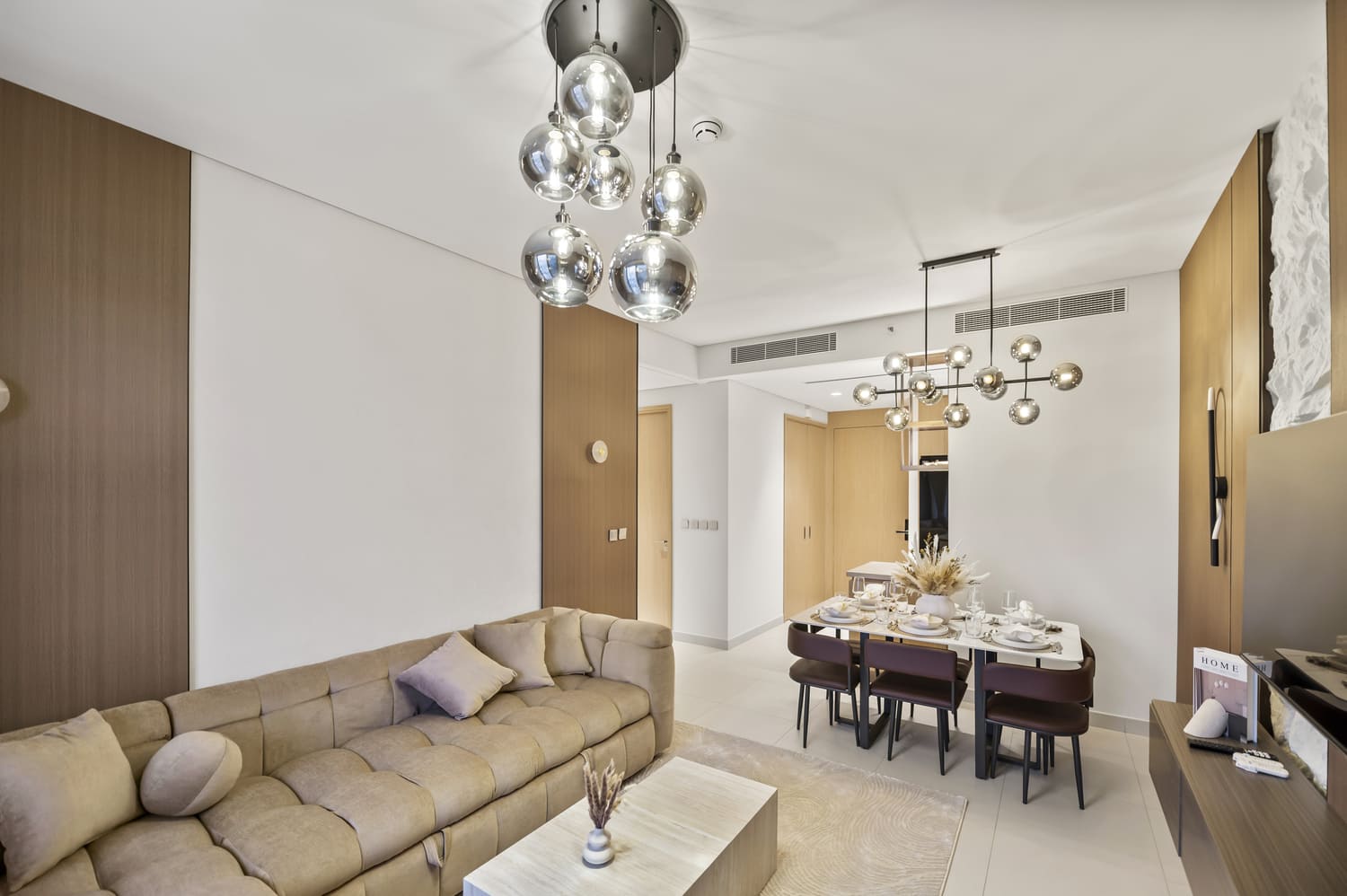Open dining and living room layout captured with zero vertical distortion at Vida Tower 2 Dubai Mall
