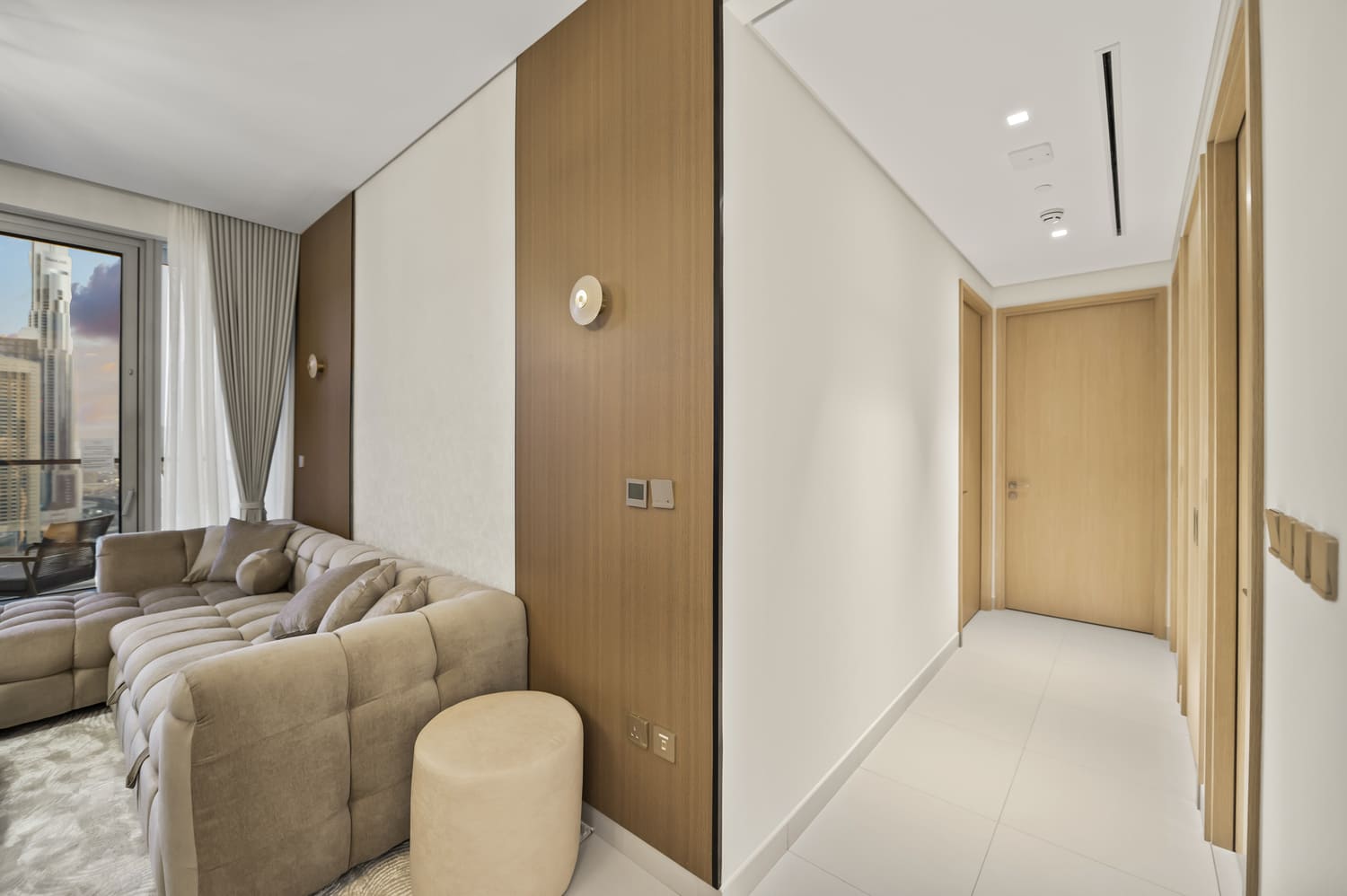 Sleek entrance hallway corridor leading into the open-plan living room at Vida Tower 2 Dubai Mall