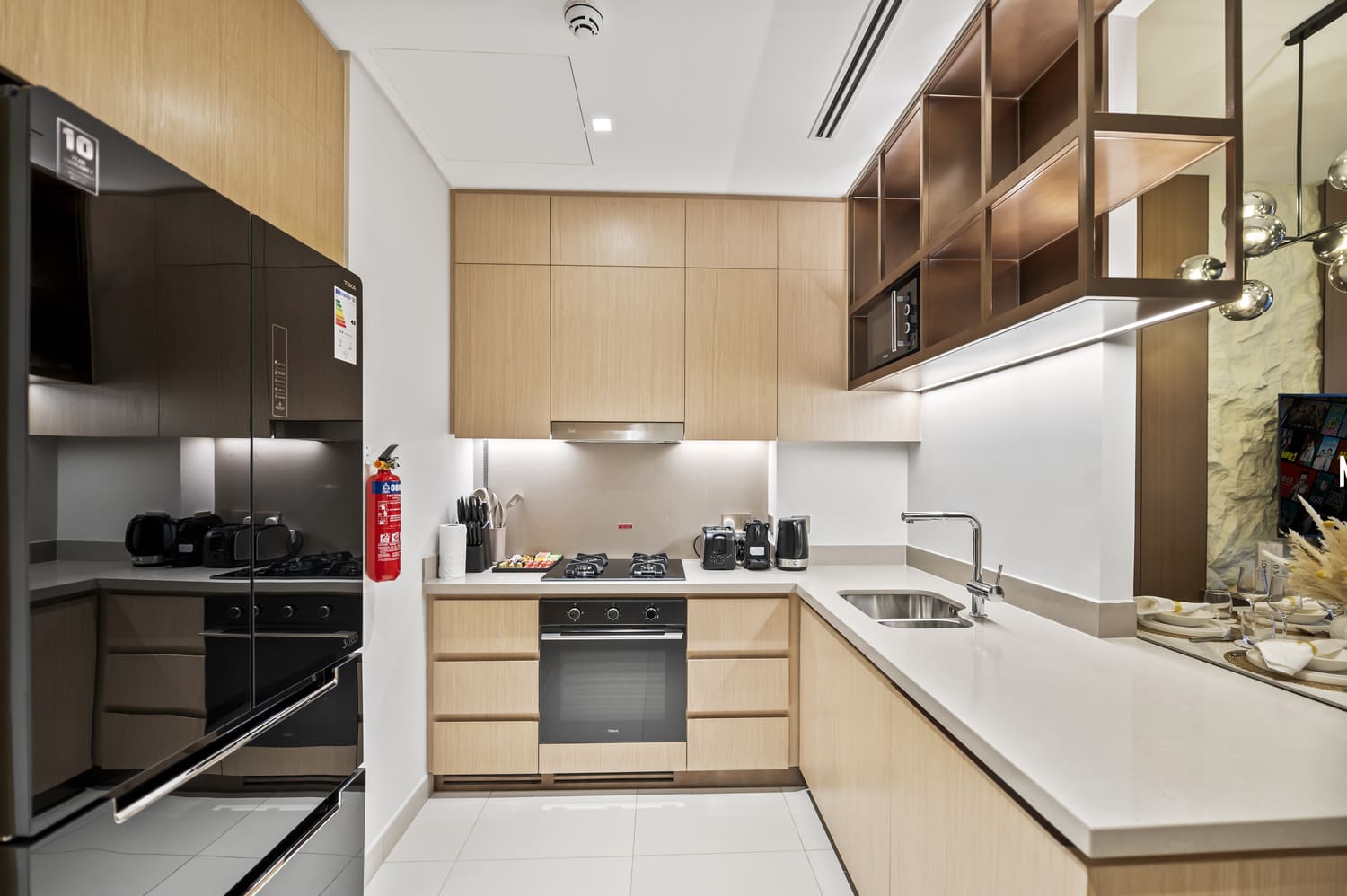 Fully equipped holiday home kitchen with stainless steel appliances at Vida Tower 2 Downtown Dubai