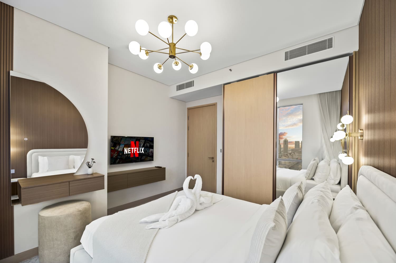 Luxury master bedroom interior with upholstered headboard and warm bedside lamps at Vida Tower 2