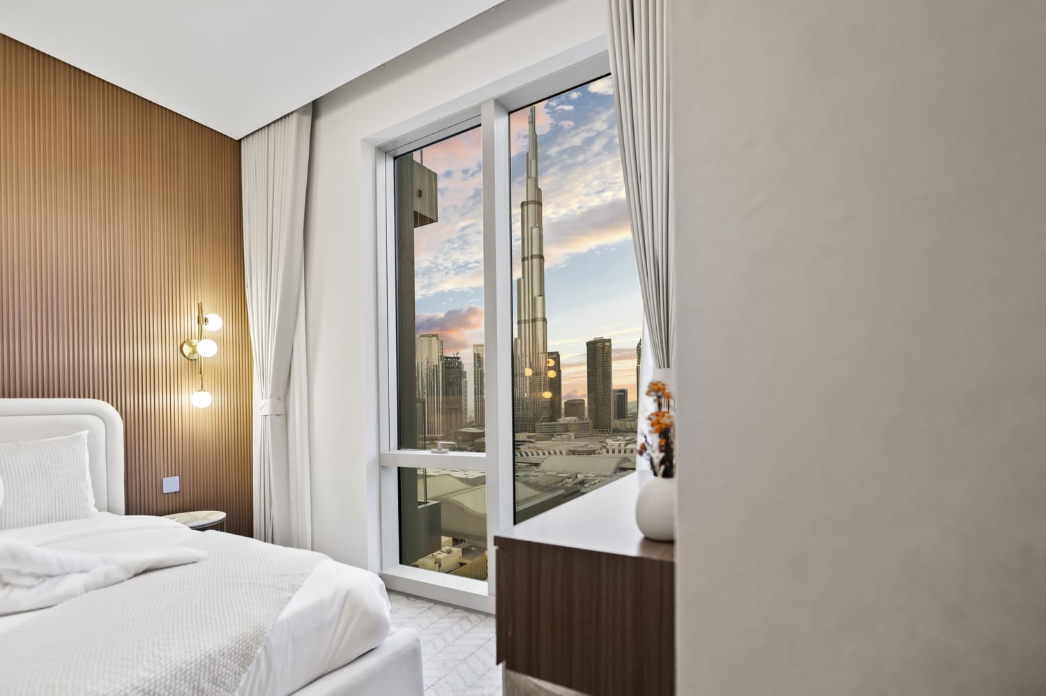 Elegant bedroom suite styled for luxury vacation rental guests in Vida Tower 2 Downtown Dubai