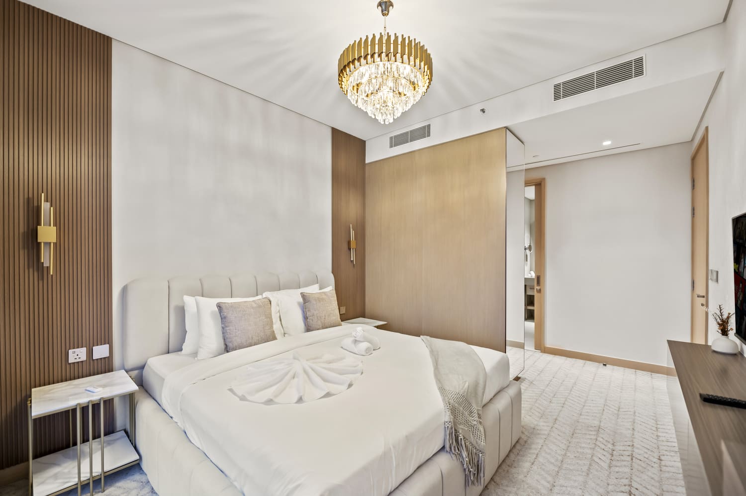 Full bedroom perspective showing wardrobe, bed setup, and window drapes at Vida Tower 2