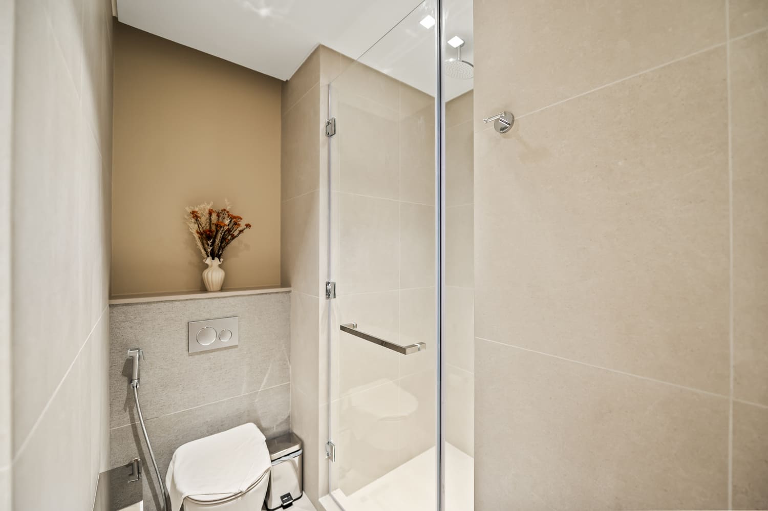 Contemporary bathroom basin, chrome fixtures, and fresh hotel towels at Vida Tower 2 Downtown Dubai