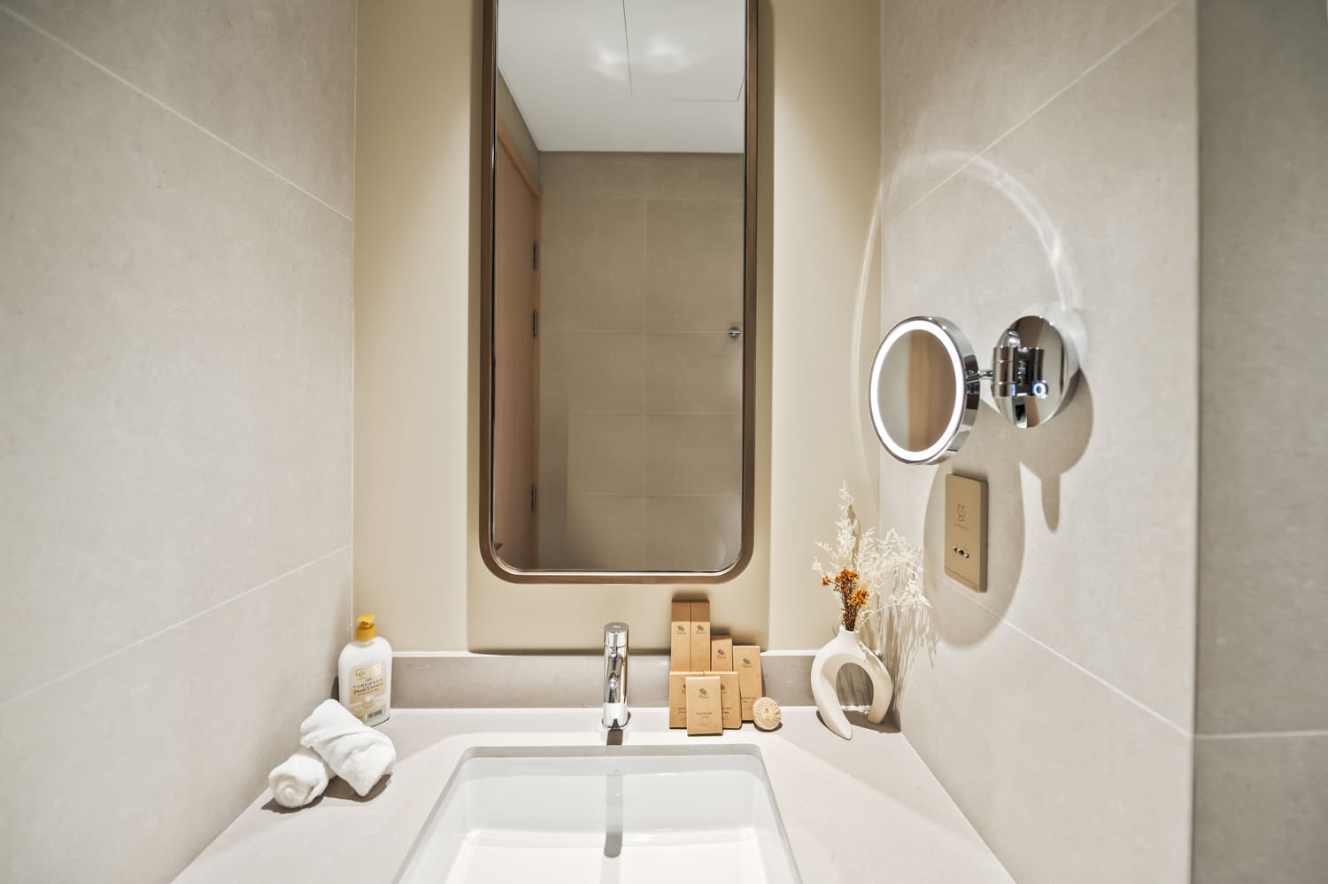 Reflection-free bathroom photography showcasing pristine porcelain tiles at Vida Tower 2 Dubai Mall